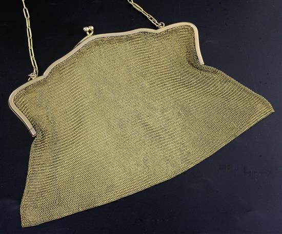 An early 20th century 9ct gold mesh evening purse, with cabochon cut sapphire set clasp, gross 292 grams.